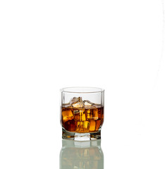a glass of whiskey with ice isolated on white background