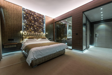 Hotel bedroom interior with private bathroom