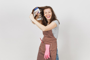 Young fun crazy dizzy loony wild housewife in striped apron with squeegee, pink gloves in pocket...