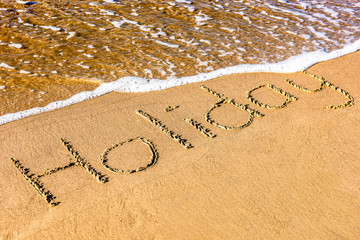 Holiday - Schrift im Sand