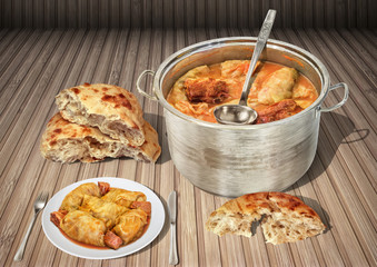 Plateful Of Gourmet Pickled Cabbage Rolls Cooked With Smoked Pork Ham Chunks Served With Fresh Domestic Fireplace Baked Leavened Pitta Flatbread Torn Loaves On Rustic Wooden Slatted Place Mat