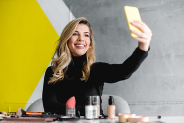 Beautiful woman making selfie