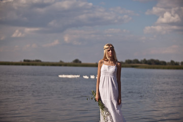 a young innocent girl at the lake