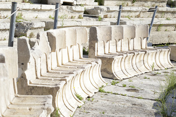 Stone chairs in the ancient Theatre of Dionysus Eleuthereus seen from the hill of Athens Acropolis, Greece