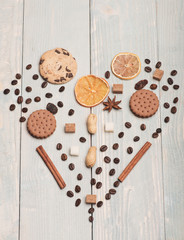 Pattern made of coffee beans, cookies, dry orange and anise