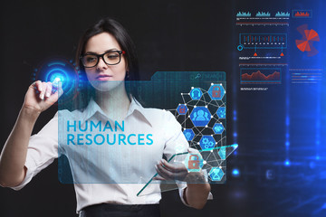 The concept of business, technology, the Internet and the network. A young entrepreneur working on a virtual screen of the future and sees the inscription: Human resources