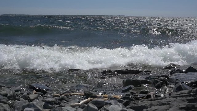 Slow Motion Waves Crashing into Rocky Shore