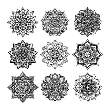 Set of round hand drawn mandala on white isolated background. Vector hipster mandala in monochrome. Mandala with floral patterns. Yoga template.