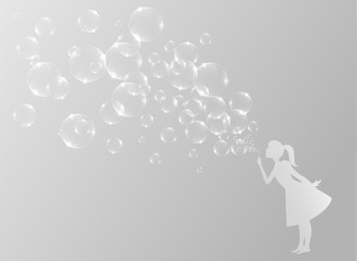 Little girl blowing bubbles