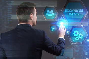 Business, Technology, Internet and network concept. Young businessman working on a virtual screen of the future and sees the inscription: Exchange rates