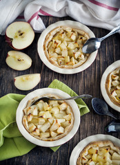 Apple tart in a ceramic baking dish. Toned image