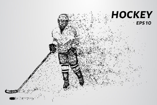 Hockey player slides on the ice with the puck. Hockey consists of particles.