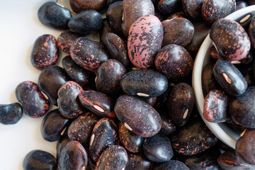 Dried kidney brown speckled beans The concept of proper nutrition and healthy lifestyle. Top view, close-up as background or texture