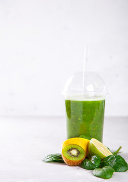 Smoothies Green. Drink Cocktail Spinach,Apple,Kiwi,Lemon,lime,avocado.Food or Healthy diet concept.Vegetarian.Copy space for Text. selective focus.