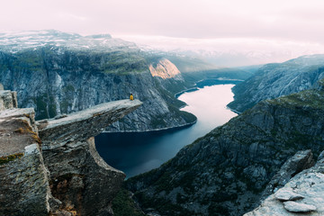 Breathtaking view of Trolltunga rock - most spectacular and famous scenic cliff in Norway....