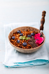 Berry Smoothie Oatmeal,Granola with Yogurt in the  bowl.Detox. Breakfast Pudding topped with goji berries, blueberries,  and chia seeds.Concept of Healthy Food.Copy space. selective focus.