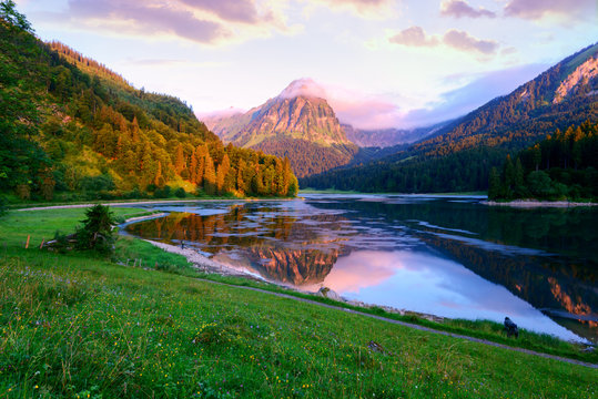 Amazing summer morning on the fantastic Swiss lake Obersee, located near Nafels village. Alps, Switzerland, Europe. Landscape photography