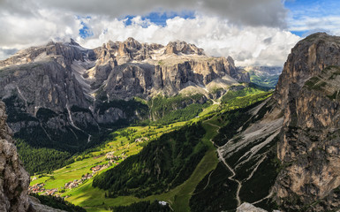 high Badia Valley in Dolomites, on background Sella mount