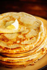 Pancakes with banana, nuts and honey. Traditional Russian cuisine. Maslenitsa. Dessert.