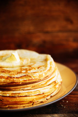 Pancakes with banana, nuts and honey. Traditional Russian cuisine. Maslenitsa. Dessert.