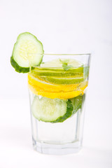 Detox Infused Water with Lemon, Lime,Cucumber and Mint in glass on a White Background.Healthy Beverage.Food diet concept.Vegetarian.selective focus.