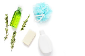 Fototapeta na wymiar Spa cosmetics/ Flat lay herbal organic bath products. Essential oil, rosemary herbs, soap, shampoo and sponge
