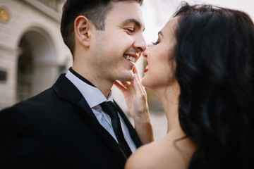 Bride and groom walking through the old town