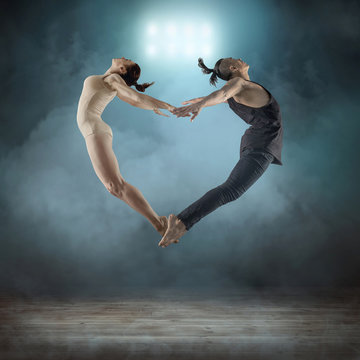 Two person, dancers, woman and man in dynamic action figure pose