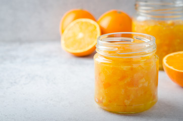Orange jam in a glass jar