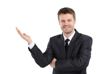 smiling businessman pointing copy space.