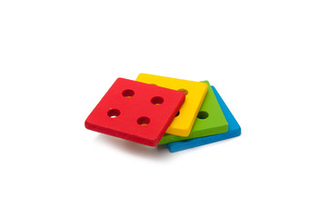 wooden toy children sorter with small wooden details in the form of geometric shapes