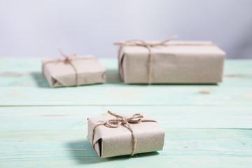 Gift boxes wrapped kraft paper tied with twine and paper snowflake and tied with twine. with copy space