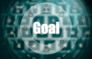 A goal concept on a futuristic computer display over a blured image of a keyboard.