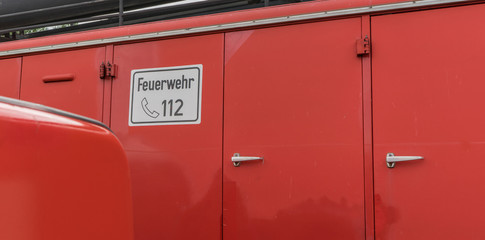 Fire Department / Detail of a fire truck with german text: Fire Department 112