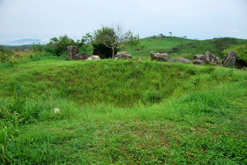 Bomb craters from the Vietnam War surround giant megalithic stone urns at the Plain of Jars archaeological site in Loas. This area is the world's most heavily bombed place