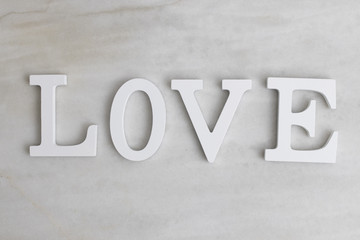 text with word love in the background of marble