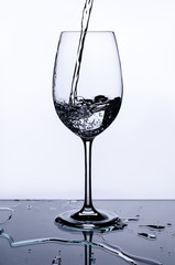 the water is pouring into the glass