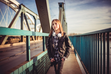 Girl walking across the bridge