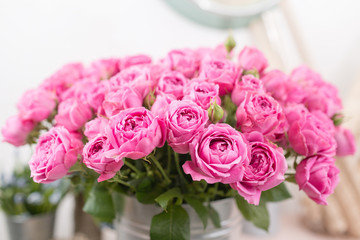 Rose Misty Bubbles. Bouquet flowers of pink roses in metal vase. Shabby chic home decor. florist at a flower shop.