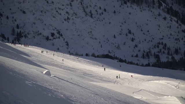 Skiers on the slope in Alps, Bormio, Italy