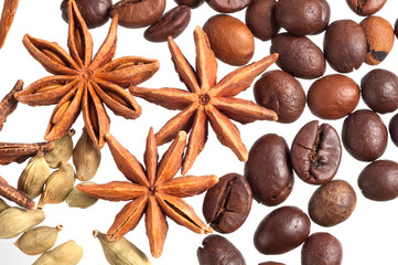 Coffee beans, anise and cardamom close-up on a white background