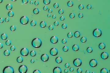 Small micro drops of water behind glass