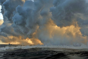 The hot lava of the Hawaiian volcano Kilauea flows into the waters of the Pacific Ocean
