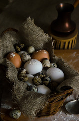 Chicken and quail eggs are on the kitchen table