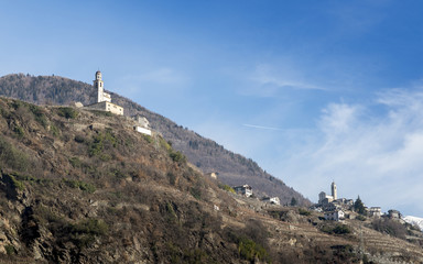 Fototapeta na wymiar Church on hilltop in Valtellina, a valley near Sondrio in the Lombardy region of northern Italy, bordering Switzerland