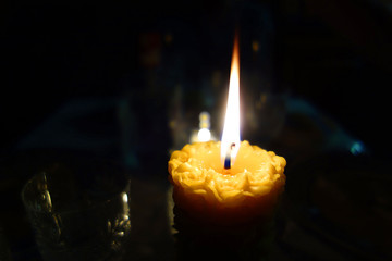 Candle in the still-life of darkness