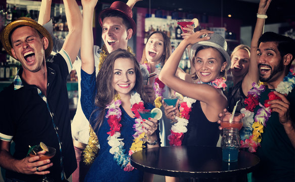 Friends Dancing On Hawaiian Party