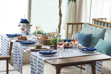 Restaurant table set with glasses, napkins and cutlery