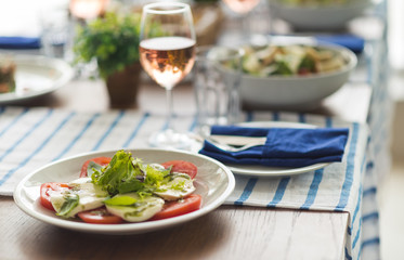Restaurant table set with glasses, napkins and cutlery