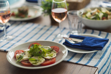 Restaurant table set with glasses, napkins and cutlery